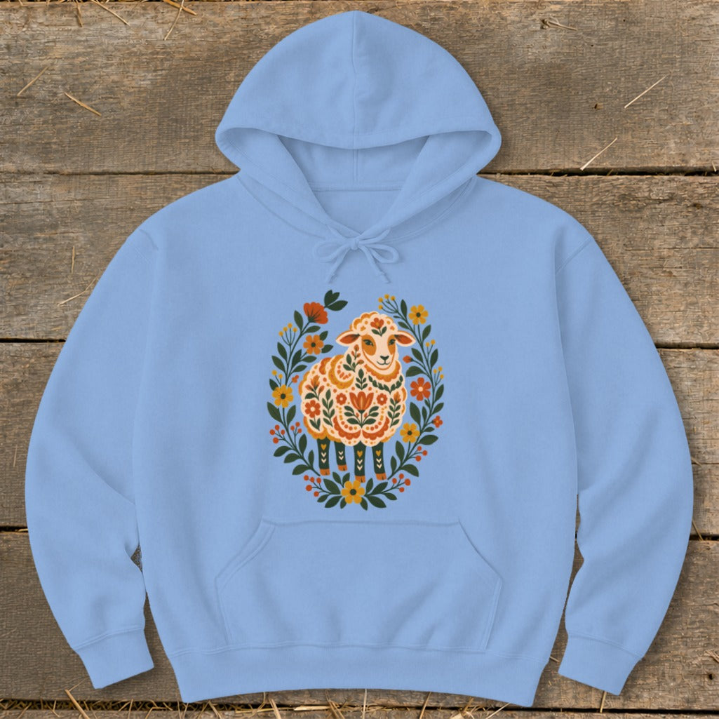 Light blue hoodie with a stylized sheep illustration surrounded by flowers.