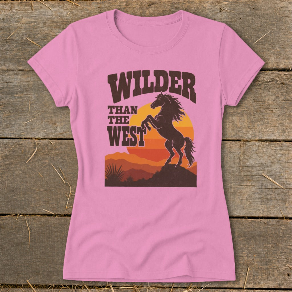 Pink t-shirt with "Wilder Than The West" text and bucking horse graphic.