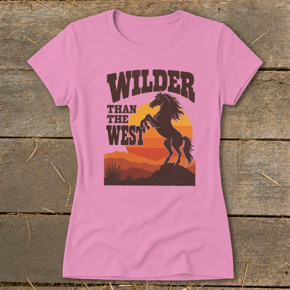 Pink t-shirt with "Wilder Than The West" text and bucking horse graphic.