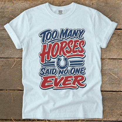 White t-shirt with text "Too many horses said no one ever" and a horseshoe graphic.