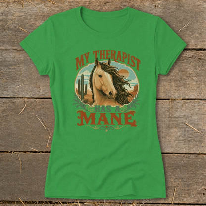 Bright green short-sleeve t-shirt with a vintage-style graphic of a horse and desert scene, featuring the text MY THERAPIST HAS A MANE.