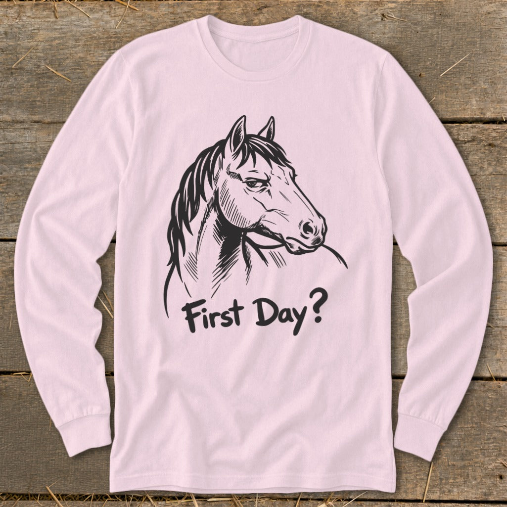 Pink long-sleeve shirt with a sketched horse head and the text "First Day?".