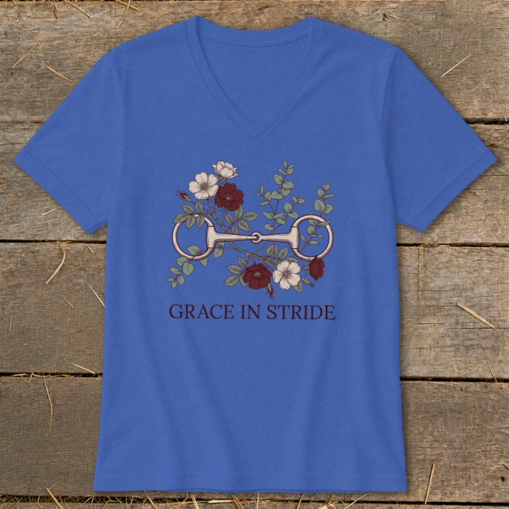 Blue t-shirt with a horse bit, roses, and eucalyptus, reading "GRACE IN STRIDE".