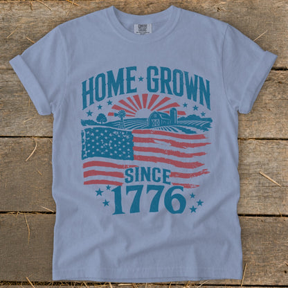 Light blue t-shirt with "HOME GROWN SINCE 1776" and American flag design.