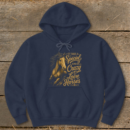 Navy hoodie with golden text and horse graphic reading "It takes a special kind of crazy to love horses."