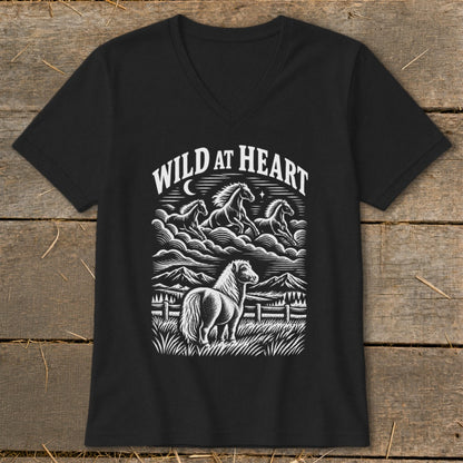 Black t-shirt with "WILD AT HEART" graphic featuring horses and mountains.