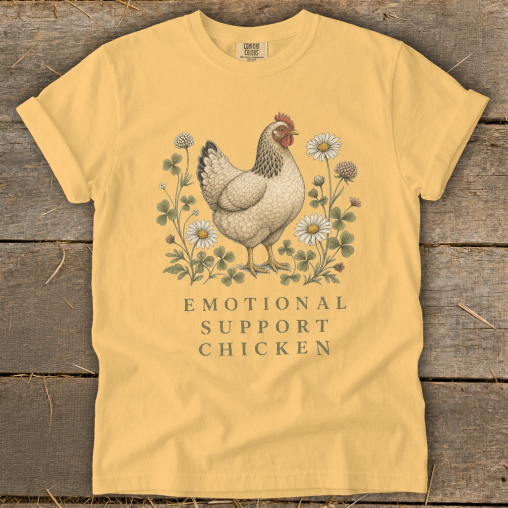 Yellow t-shirt with a chicken graphic and "Emotional Support Chicken" text.