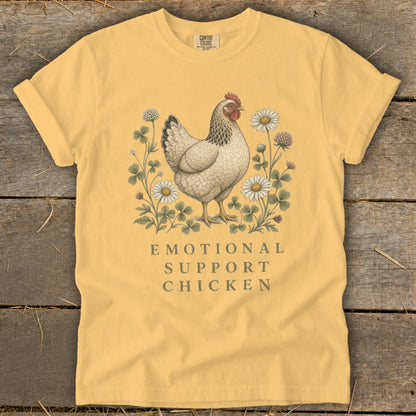 Yellow t-shirt with a chicken graphic and "Emotional Support Chicken" text.