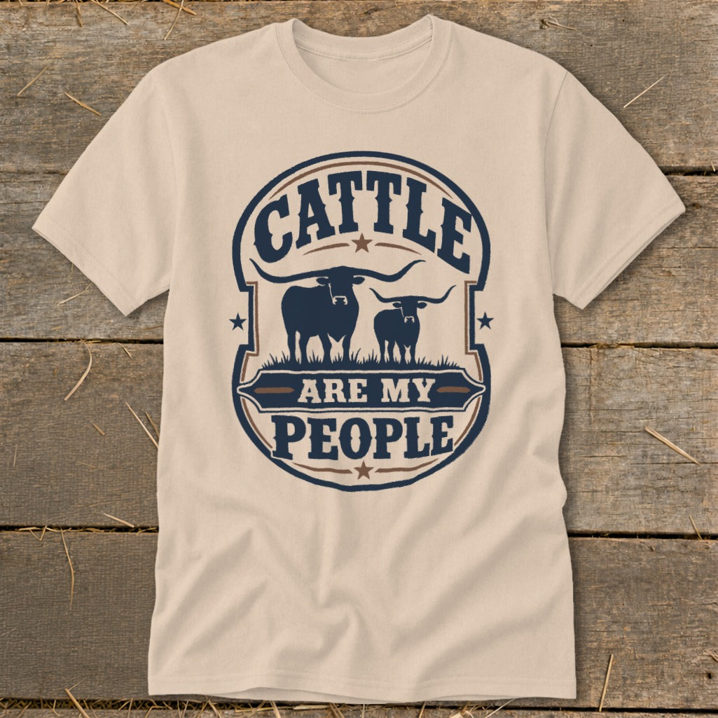 Cream t-shirt with "Cattle Are My People" text and two longhorn silhouettes.