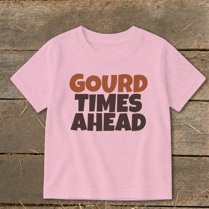 Pink t-shirt with text "GOURD TIMES AHEAD" in brown and dark brown lettering.