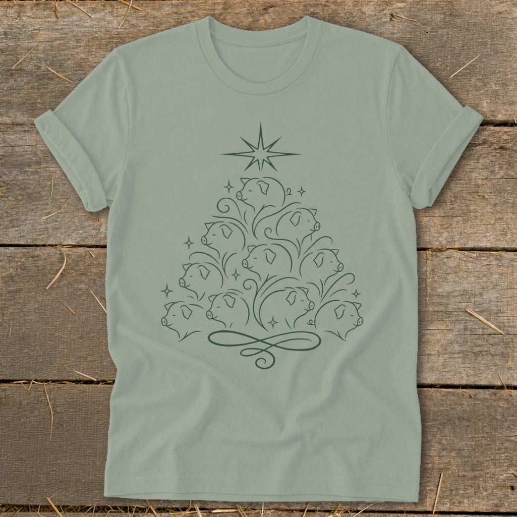 Green t-shirt with a Christmas tree design made of pig outlines and a star.