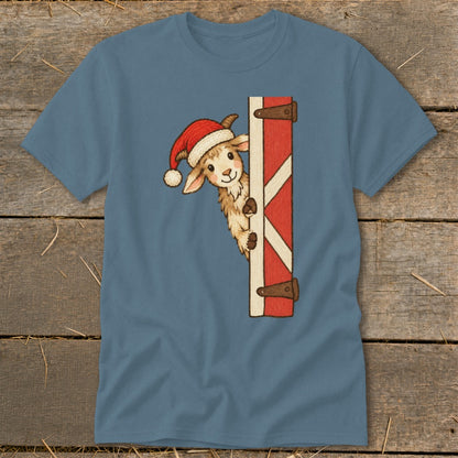 Goat wearing Santa hat peeking from behind a red and white barn door.