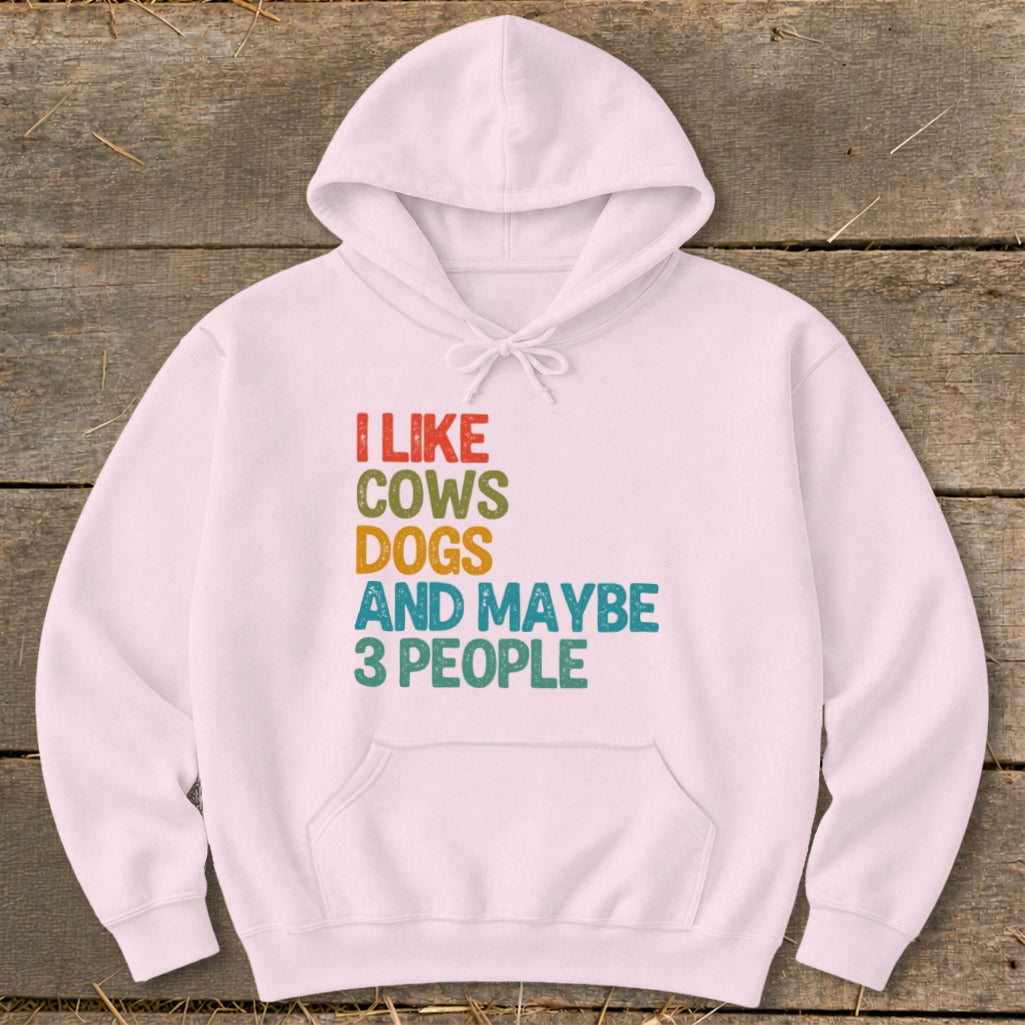 Pink hoodie with text "I LIKE COWS DOGS AND MAYBE 3 PEOPLE".