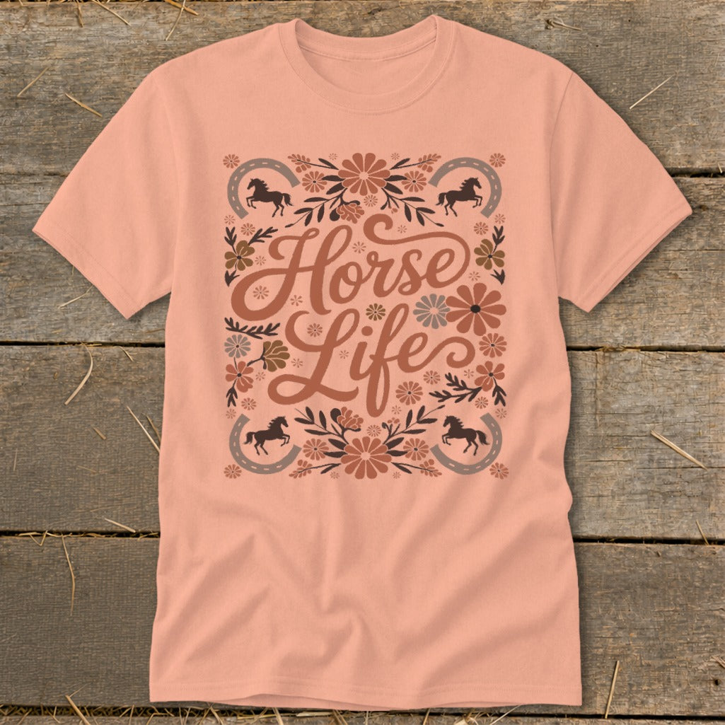 Peach t-shirt with "Horse Life" text surrounded by flowers and horseshoes.