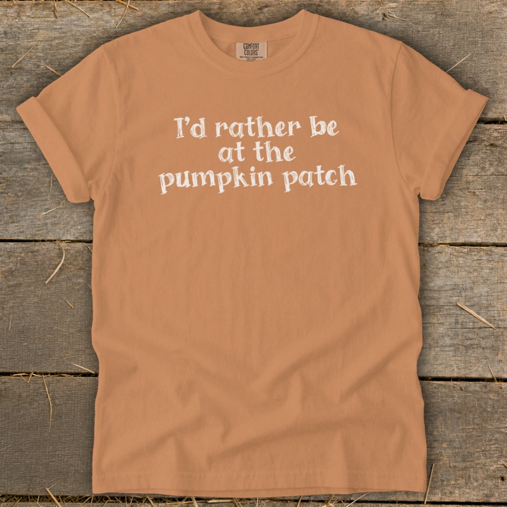 Orange t-shirt with white text that says "I'd rather be at the pumpkin patch."