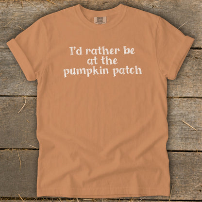 Orange t-shirt with white text that says "I'd rather be at the pumpkin patch."