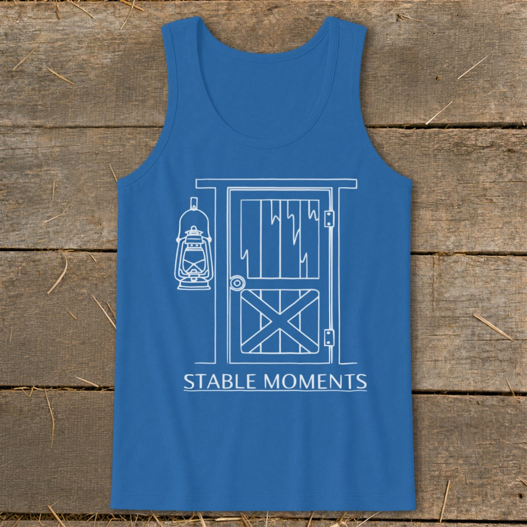 Blue tank top with white line art of a barn door and lantern, reading "STABLE MOMENTS".