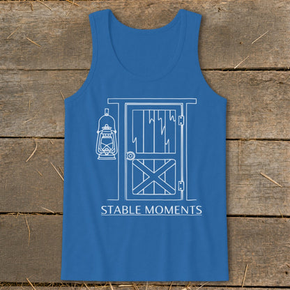 Blue tank top with white line art of a barn door and lantern, reading "STABLE MOMENTS".
