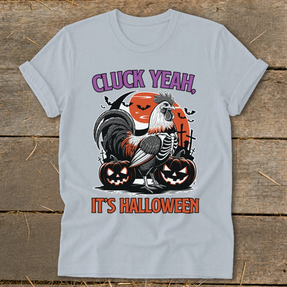 Rooster skeleton with pumpkins and bats graphic reads "Cluck Yeah, It's Halloween".