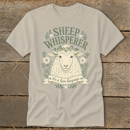 Grey t-shirt with sheep illustration and text "SHEEP WHISPERER" and "it's a love language".