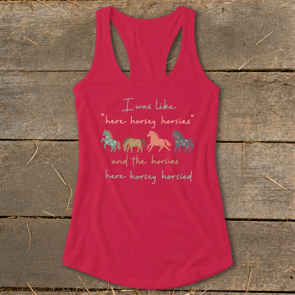 Pink racerback tank top with four illustrated horses and text.