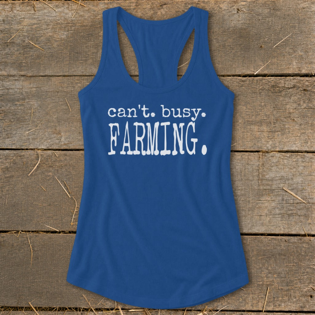 Royal blue racerback tank top with white text that reads "can't. busy. FARMING."