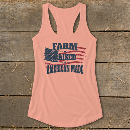 Peach tank top with distressed American flag and text "FARM RAISED AMERICAN MADE".