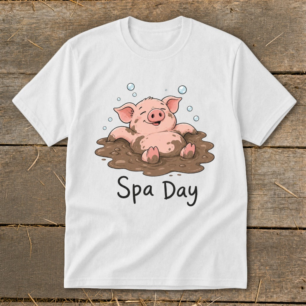 White t-shirt with a cartoon pig in mud with "Spa Day" text.