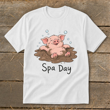 White t-shirt with a cartoon pig in mud with "Spa Day" text.