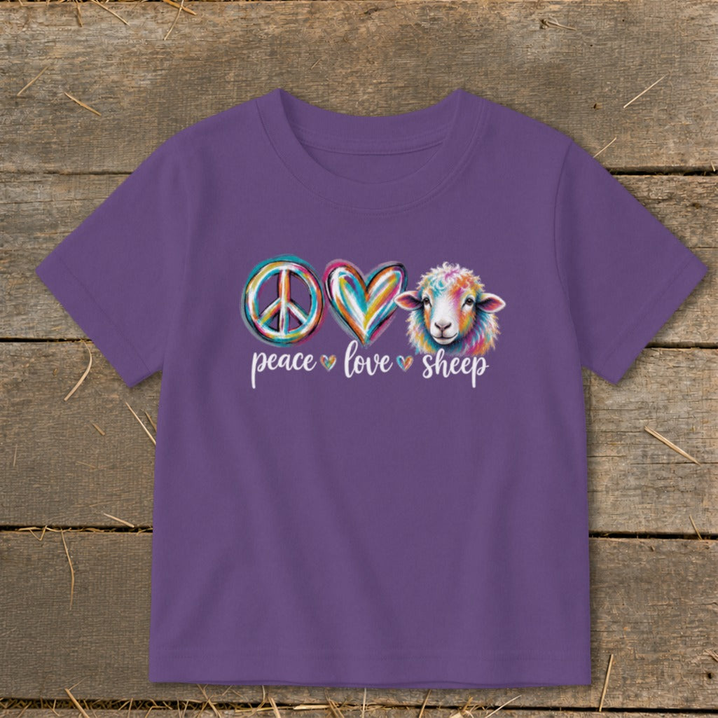 Purple t-shirt with peace, heart, and sheep graphics and text.