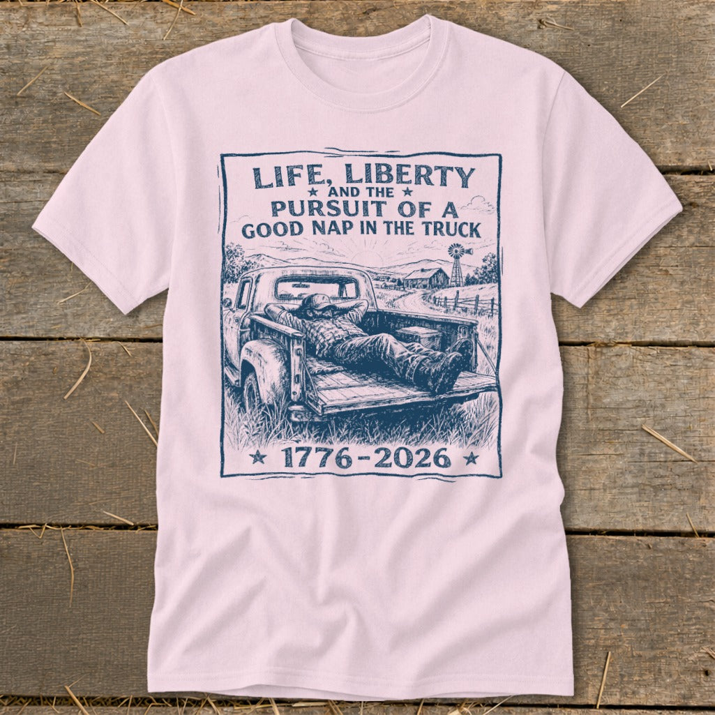 T-shirt with graphic of man napping in truck bed, "Life, Liberty and the Pursuit of a Good Nap"