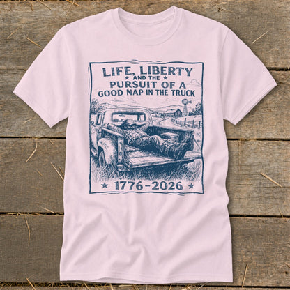 T-shirt with graphic of man napping in truck bed, "Life, Liberty and the Pursuit of a Good Nap"