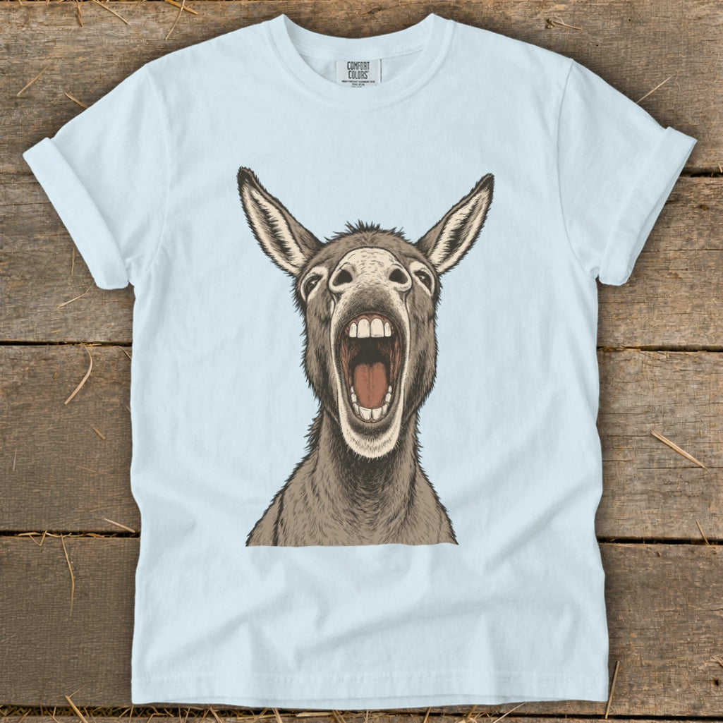 Light blue t-shirt with a drawing of a donkey with its mouth wide open.