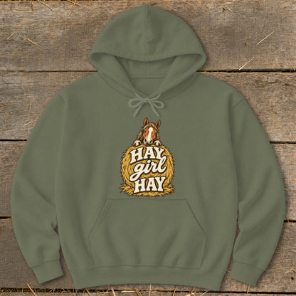 Olive green hoodie with a horse on a hay bale graphic that says "HAY girl HAY".