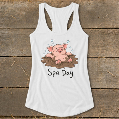 White tank top with cartoon pig in mud, reading "Spa Day".