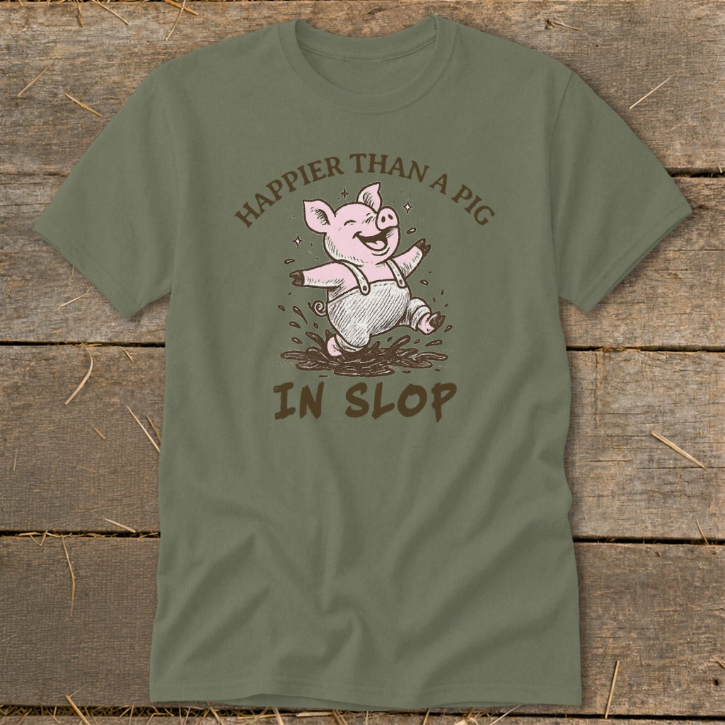 Green t-shirt with a cartoon pig jumping in slop, text reads "Happier than a pig in slop".