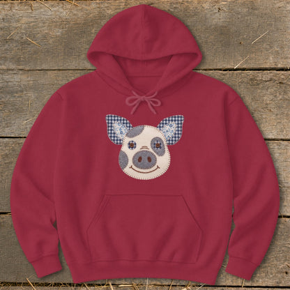 Maroon hoodie with a felt pig face applique and checkered ears.