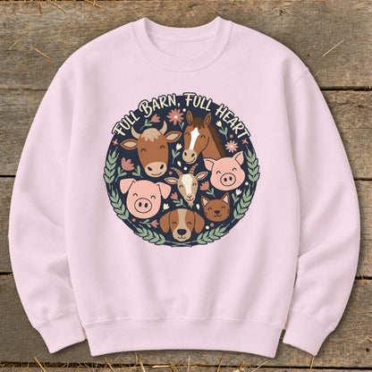Pink sweatshirt with circular farm animal graphic and text "FULL BARN, FULL HEART".