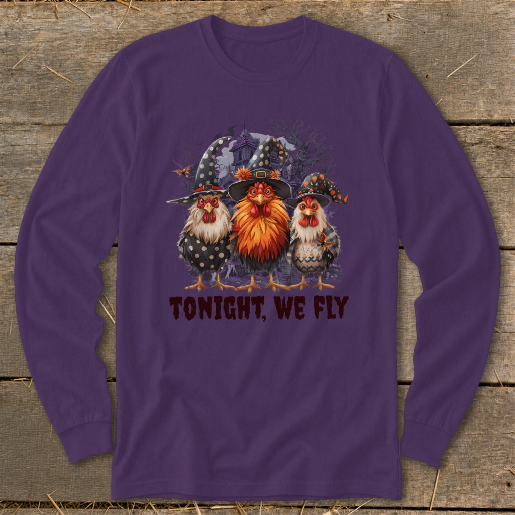 Three witch hat-wearing chickens stand before a haunted house with the text "TONIGHT, WE FLY."