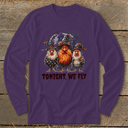 Three witch hat-wearing chickens stand before a haunted house with the text "TONIGHT, WE FLY."