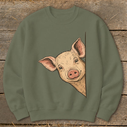 Crewneck sweatshirt with a drawing of a curious pig peeking around a corner.