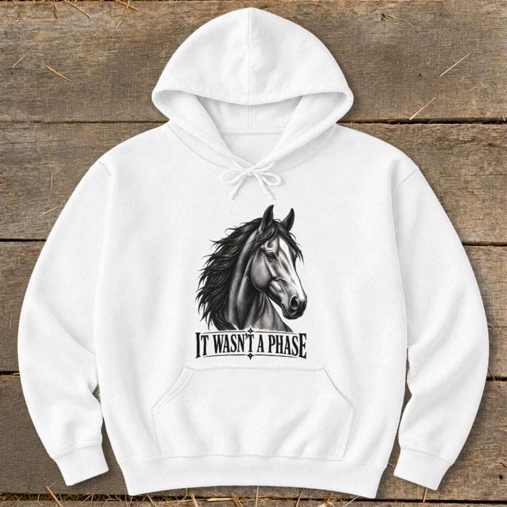 White hoodie with a black and white drawing of a horse and the text "IT WASN'T A PHASE".