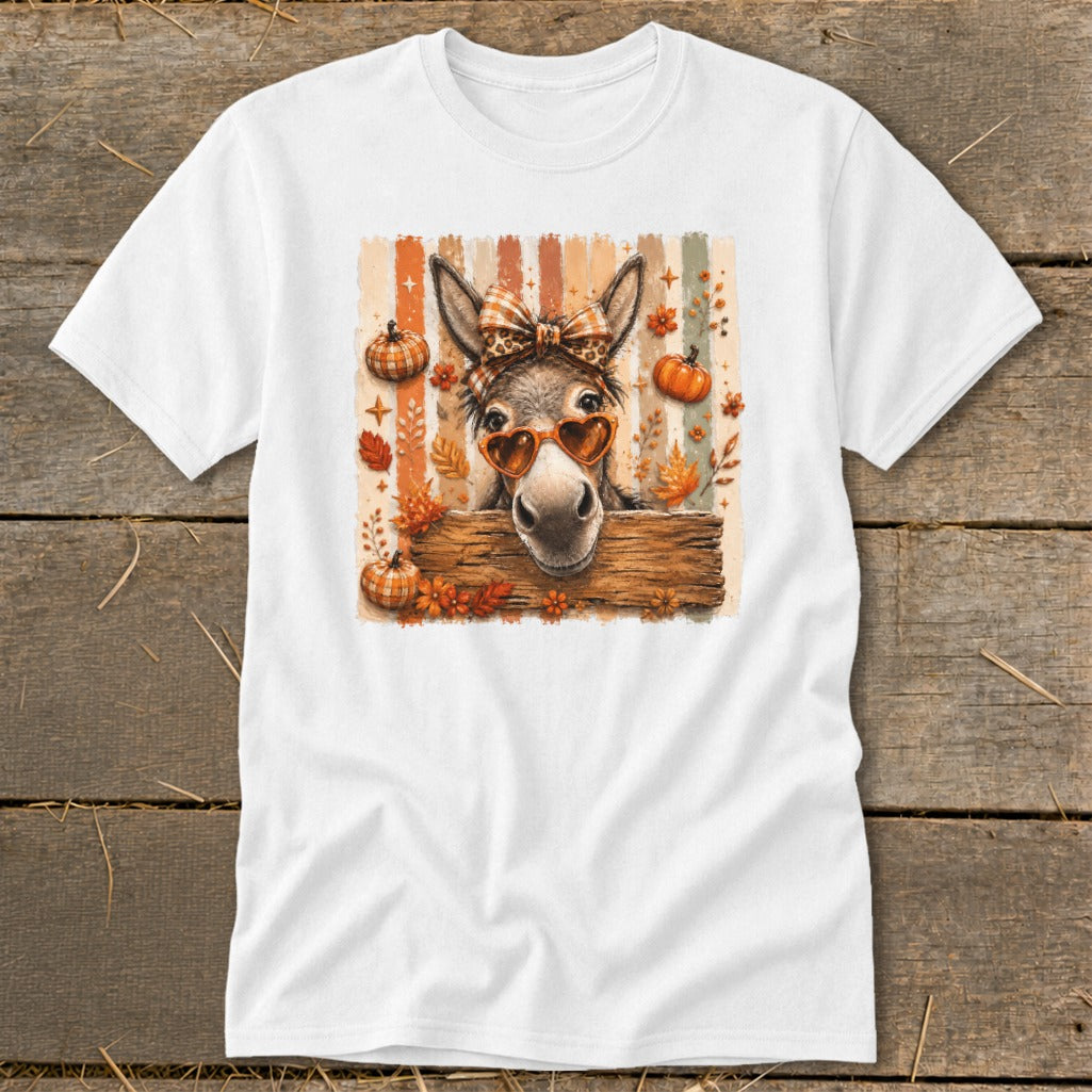Donkey wearing heart sunglasses and bandana on a striped background with pumpkins and leaves.