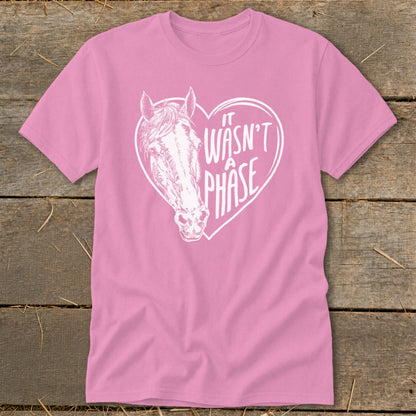 Pink t-shirt with a horse head inside a heart that says "It Wasn't A Phase".
