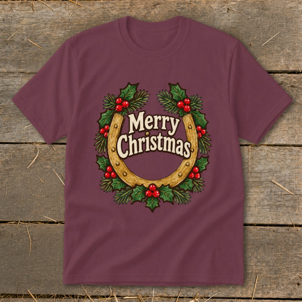 Maroon t-shirt with a horseshoe and holly wreath graphic saying "Merry Christmas".