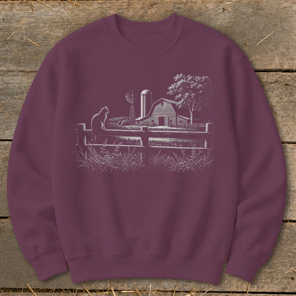 Sweatshirt with farm scene art: cat on fence, barn, windmill, and tree.