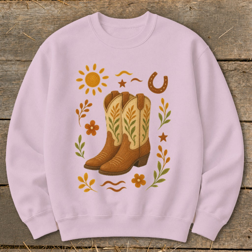 Light pink sweatshirt with cowboy boot and western-themed graphic art design.