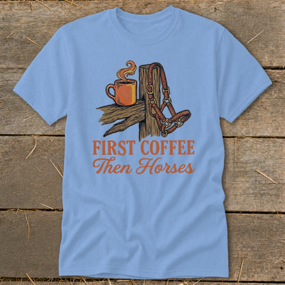 Light blue t-shirt with illustration of coffee and horse halter, reads "First Coffee Then Horses".