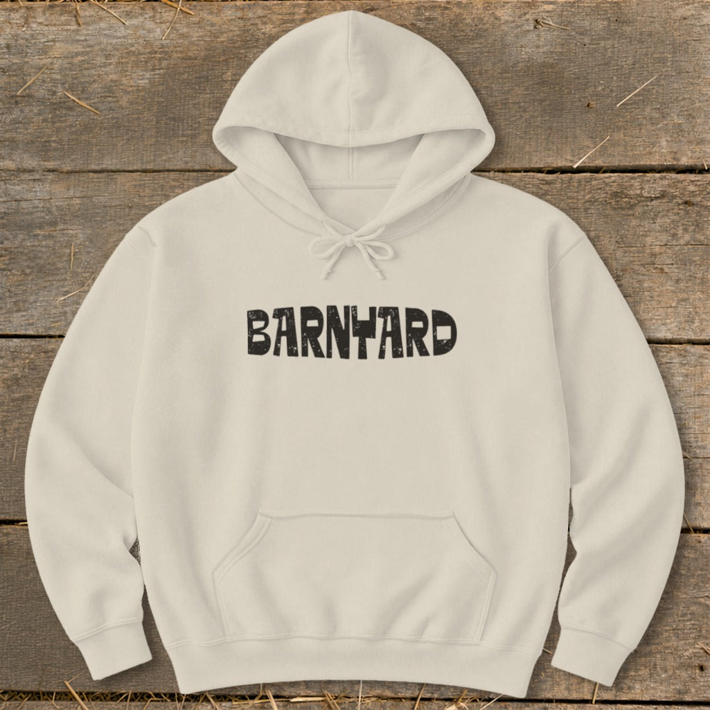 Cream-colored hooded sweatshirt with a front pocket and the word BARNYARD printed in distressed black letters.