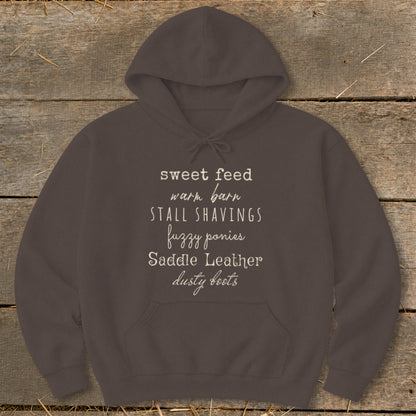Brown hoodie with white text listing horse-related items.